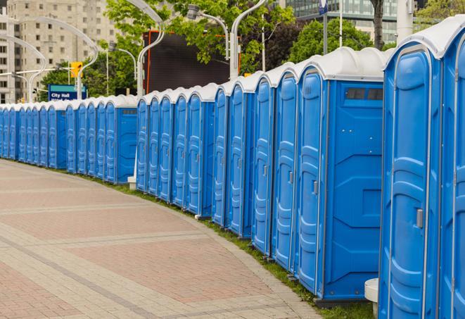 a fleet of portable restrooms ready for use at a large outdoor wedding or celebration in Anaheim